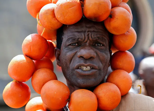 A supporter of the opposition National Super Alliance (NASA) wears oranges during a protest calling for the sacking of election board officials involved in August's cancelled presidential vote, in Nairobi, Kenya October 9, 2017. (Photo by Baz Ratner/Reuters)