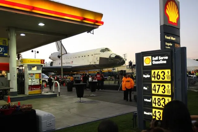 People gather as the space shuttle Endeavour is transported to the California Science Center in Exposition Park from Los Angeles International Airport (LAX) on October 12, 2012 in Los Angeles, California. (Photo by David McNew)