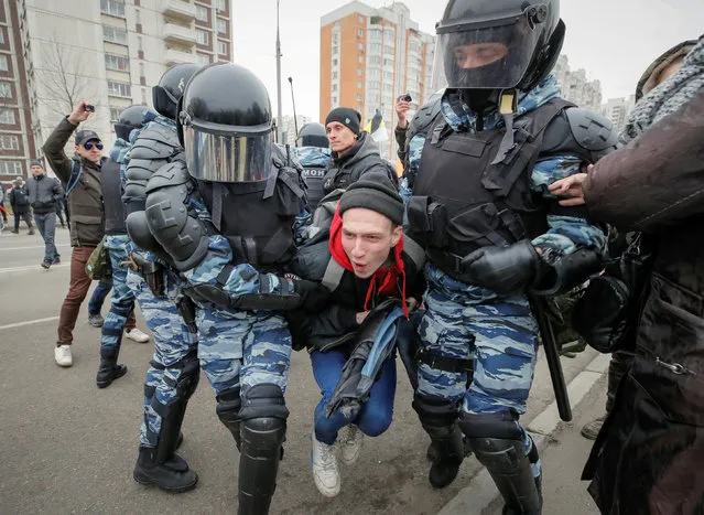 Police officers detain a participant of a Russian nationalist march on National Unity Day in Moscow, Russia November 4, 2017. (Photo by Maxim Shemetov/Reuters)