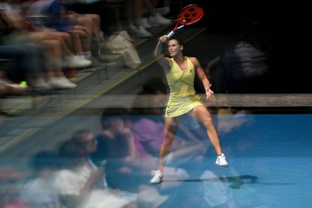 Spectator crowds are seen in a reflection as they watch Emma Navarro of the USA in action during her round 3 match against Dayana Yastremska of Ukraine on Day 7 of the 2024 Australian Open at Melbourne Park in Melbourne, Saturday, January 20, 2024. (Photo by Lukas Coch/AAP Image)