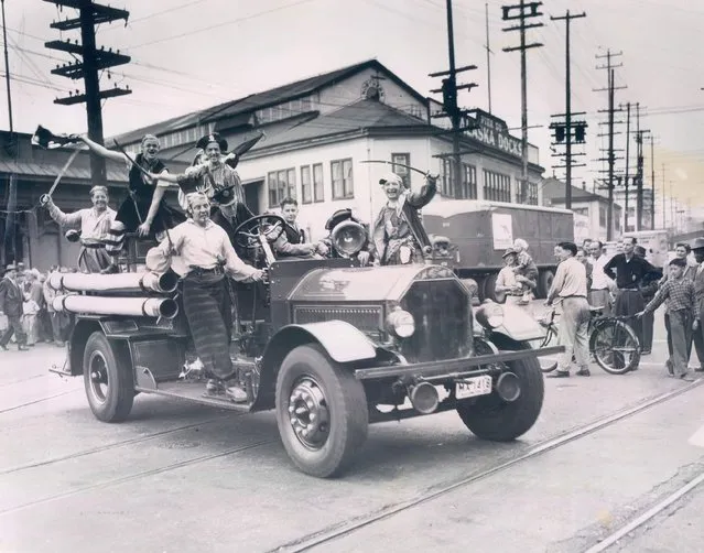 Members of Davy Jones’ crew boarded a fire engine after landing on the Seattle waterfront on August 14, 1950. (Photo by George Carkonen/The Seattle Times)