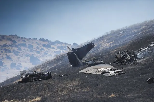 The wreckage of a U-2 spy plane that crashed after taking off from Beale Air Force Base on a training mission in Northern California, is seen Tuesday, September 20, 2016. Authorities say two pilots ejected before the crash Tuesday morning in the Sierra Buttes about 60 miles north of Sacramento. The plane was destroyed and a resulting fire scorched several acres. (Photo by Hector Amezcua/The Sacramento Bee via AP Photo)