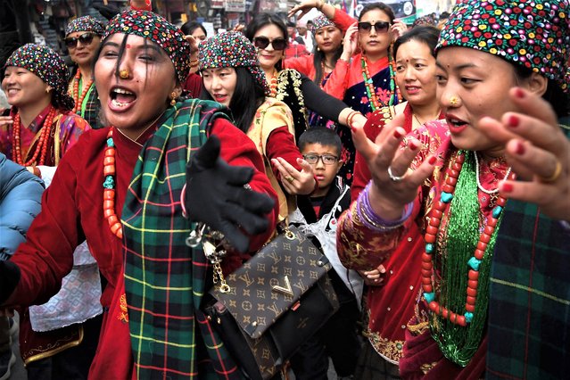 Members of indigenous Gurung community wearing traditional attire takes part with others in a New Year celebration ceremony known as “Tamu Lhosar” in Kathmandu on December 30, 2022. (Photo by Prakash Mathema/AFP Photo)