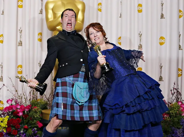 Mark Andrews (L) and Brenda Chapman pose with their Oscar for best animated feature film for “Brave” at the 85th Academy Awards in Hollywood, California February 24, 2013. (Photo by Mike Blake/Reuters)