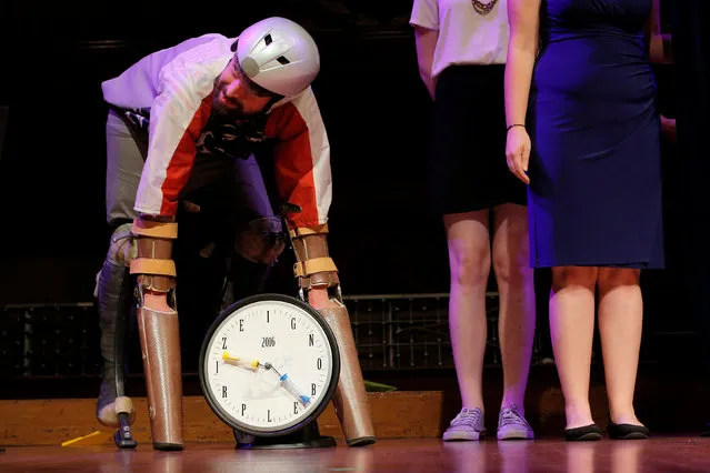 Thomas Thwaites of the United Kingdom accepts the 2016 Ig Nobel Prize in Biology for “creating prosthetic extensions of his limbs that allowed him to move in the manner of, and spend time roaming the hills in the company of, goats” during the 26th First Annual Ig Nobel Prize ceremony at Harvard University in Cambridge, Massachusetts, U.S. September 22, 2016. (Photo by Brian Snyder/Reuters)