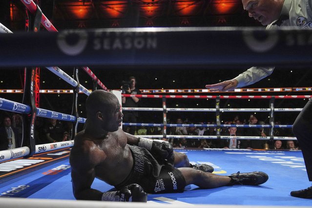 Britain's Daniel Dubois is in on the floor after a knockout by Ukraine's Oleksandr Usyk during the undisputed world heavyweight boxing title fight In London, Saturday, July 19, 2025. (Photo by Frank Augstein/AP Photo)