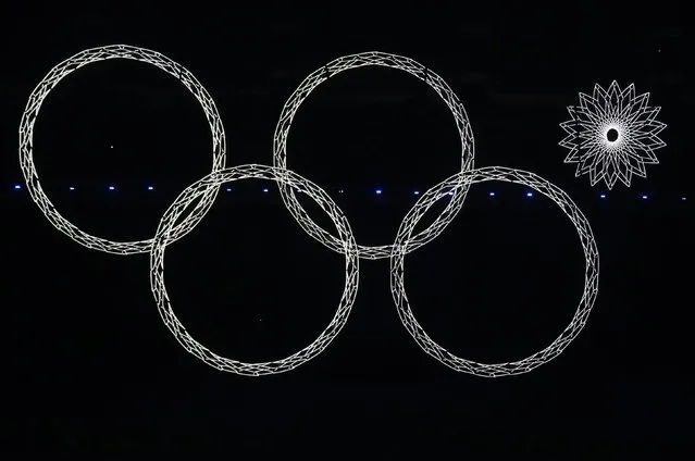 our out of five Olympic rings are seen lit up during the opening ceremony of the 2014 Sochi Winter Olympics, in this February 7, 2014 file photo. (Photo by David Gray/Reuters)
