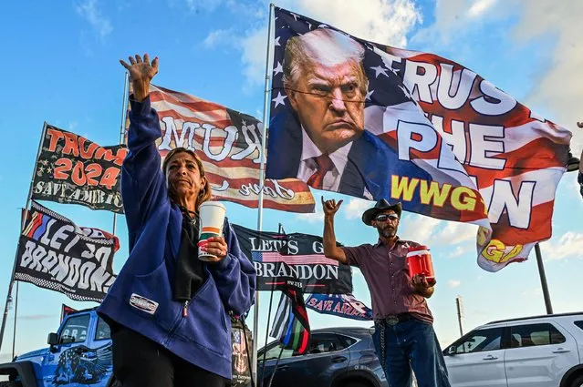 Supporters of former US President Donald Trump protest near Mar-a-Lago Club in Palm Beach, Florida, on March 21, 2023. The former president is expected to be indicted over hush money paid to a p*rn actress, with Trump calling for mass demonstrations if he is charged. (Photo by Giorgio Viera/AFP Photo)