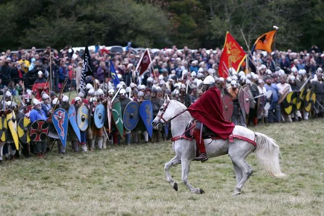 Re-enactors participate in a re-enactment of the Battle of Hastings, commemorating the 950th anniversary of the battle, in Battle, Britain October 15, 2016. (Photo by Neil Hall/Reuters)