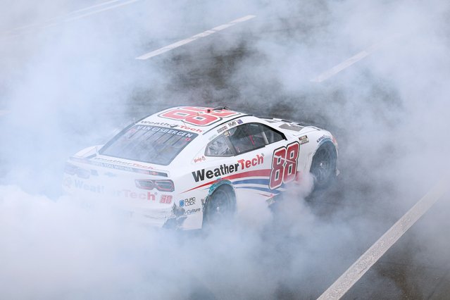 Shane Van Gisbergen, driver of the #88 WeatherTech Chevrolet, celebrates with a burnout after winning the NASCAR Cup Series Bank of America ROVAL 400 at Charlotte Motor Speedway on October 05, 2025 in Concord, North Carolina. (Photo by David Jensen/Getty Images)