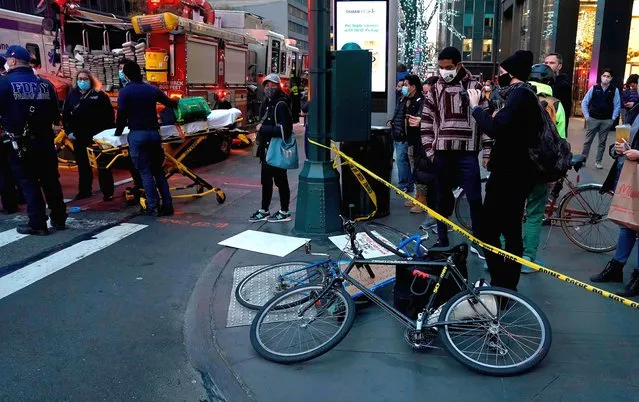 Bikes lay on the ground after a car struck multiple Black Lives Matter protesters on December 11, 2020 that were gathered at the intersection of East 39th Street and 3rd Avenue in New York. A motorist struck several pedestrians taking part in a protest in Manhattan, New York on Friday, police and media reports said. NBC News reported that the incident occurred around 4:00 pm (2100 GMT) in the Murray Hill area and that the driver was in custody. (Photo by Timothy A. Clary/AFP Photo)