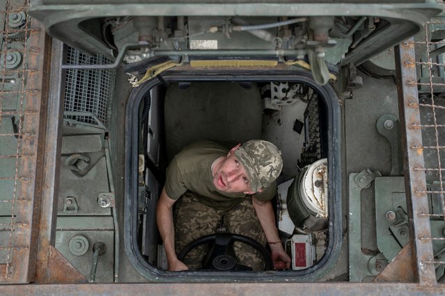 A service member of the 81st Separate Slobozhanska Airmobile Brigade of the Ukrainian Armed Forces sits inside a Stryker armoured personnel carrier during military exercises at a training ground near a front line, amid Russia's attack on Ukraine, in Donetsk region, Ukraine on June 28, 2025. (Photo by Viacheslav Ratynskyi/Reuters)