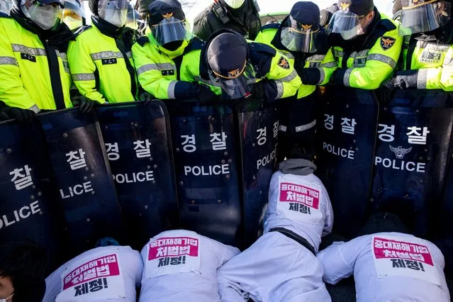 Non-regular workers in protest are clashing with police near the Yeouido National Assembly urge the enactment of the serious disaster enterprise punishment law on December 14, 2020 in Seoul, South Korea. (Photo by Sanghwan Jung/Rex Features/Shutterstock)