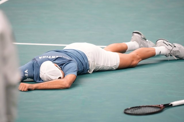 Argentina's Francisco Cerundolo flies on the ground after falling during a Davis Cup quarterfinal singles tennis match against Germany's Alexander Zverev, between Germany and Argentina, in Bologna, Italy, Thursday, November 20, 2025. (Photo by Luca Bruno/AP Photo)