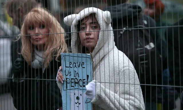 A protester wears a polar bear outfit during a rally held the day before the start of the Paris Climate Change Summit, in London, Britain November 29, 2015. (Photo by Suzanne Plunkett/Reuters)