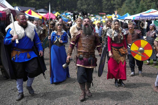 People dressed as Vikings walk through a Viking village during the Viking Fest at La Marquesa National Park on the outskirts of Mexico City, Saturday, October 12, 2024. (Photo by Eduardo Verdugo/AP Photo)