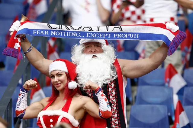Supporters of Croatia dressed as Santa Claus and Mrs Claus pose for a photograph prior to the start of the UEFA Nations League final football match between Croatia and Spain at the De Kuip Stadium in Rotterdam on June 18, 2023. (Photo by Kenzo Tribouillard/AFP Photo)