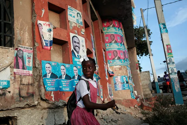 A girl walks next to electoral posters along a street in Port-au-Prince, Haiti, November 14, 2016. (Photo by Andres Martinez Casares/Reuters)