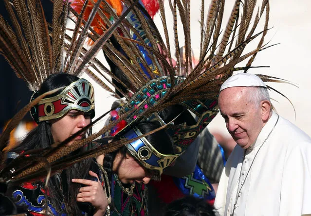 Pope Francis is greeted by people dressed in traditional Mexican outfits during his general audience in Saint Peter's Square at the Vatican, November 16, 2016. (Photo by Alessandro Bianchi/Reuters)
