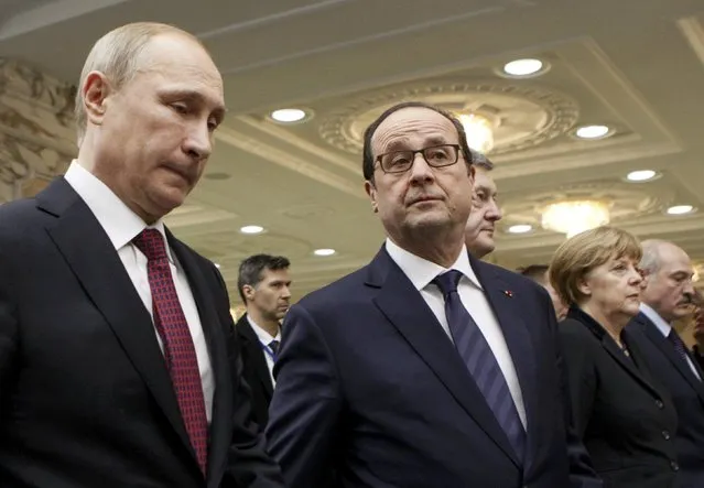 Russian President Vladimir Putin, French President Francois Hollande, Ukraininan President Petro Poroshenko, German Chancellor Angela Merkel and Belarussian President Alexander Lukashenko (L-R) walk after a meeting in Minsk, February 11, 2015. (Photo by Valentyn Ogirenko/Reuters)