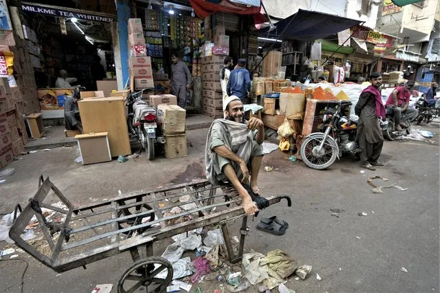 A laborer waits for work at a market, in Karachi, Pakistan, Thursday, July 13, 2023. Pakistan’s finance minister on Thursday said the International Monetary Fund deposited a much-awaited first installment of $1.2 billion with the country’s central bank under a recently signed bailout aimed at enabling the impoverished Islamic nation to avoid defaulting on its debt repayments. (Phoot by Fareed Khan/AP Photo)