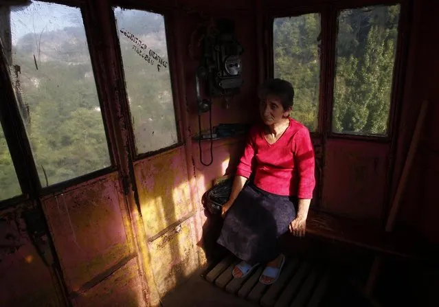 A conductor sits inside a 60-year-old cable car in the town of Chiatura, some 220 km (136 miles) northwest of Tbilisi, September 12, 2013. (Photo by David Mdzinarishvili/Reuters)