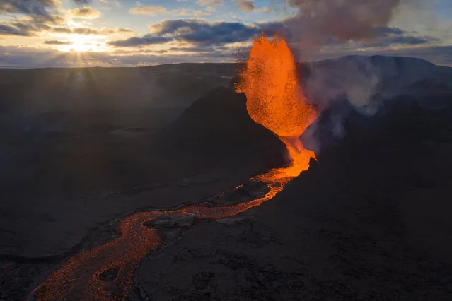 Lava flows from an eruption of the Fagradalsfjall volcano on the Reykjanes Peninsula in southwestern Iceland on Tuesday, May 11, 2021. (Photo by Miguel Morenatti/AP Photo)