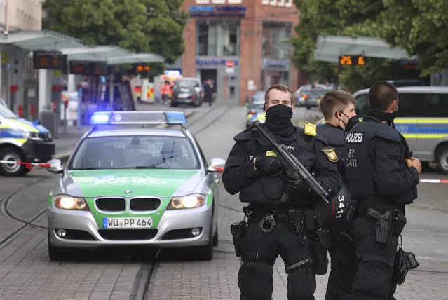 Police cars attend the scene of an incident in Wuerzburg, Germany, Friday June 25, 2021. German police say several people have been killed and others injured in a knife attack in the southern city of Wuerzburg on Friday. (Photo by Karl-Josef Hildenbrand/dpa via AP Photo)