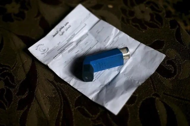 A bronchodilator is placed atop of a prescription treatment paper that belongs to Shahrour's son who is suffering from asthma, inside their home in the besieged town of Arbeen, in Damascus suburbs, Syria February 6, 2016. (Photo by Bassam Khabieh/Reuters)