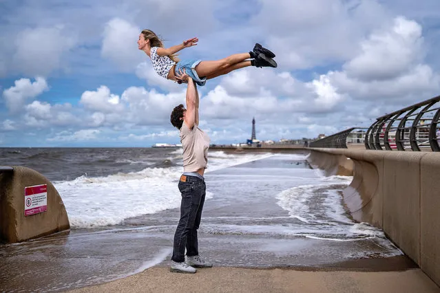 Michael O’Reilly and Kira Malou pose for the media as they perform “the lift” from Dirty Dancing on Blackpool Promenade on July 05, 2023 in Blackpool, England. “Dirty Dancing – The Classic Story on Stage” is on a 24-week tour in the United Kingdom & Ireland, which will see it visit the Winter Gardens Blackpool from 26 September to 7 October 2023. (Photo by Christopher Furlong/Getty Images)