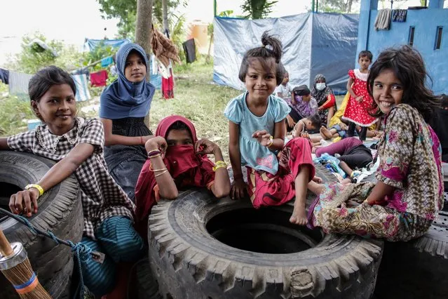 Rohingya children pose at a temporary shelter in Lapang Barat village, Bireuen, Aceh province on November 21, 2023. (Photo by Zikri Maulana/AFP Photo)