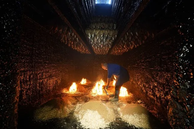 People working at Crasters kippers factory L.Robson and Sons Ltd in Northumberland, UK on Tuesday, November 21, 2023. The smokehouse in Craster, which has produced kippers for almost 170 years and has been given Grade II listed status. (Photo by Owen Humphreys/PA Images via Getty Images)