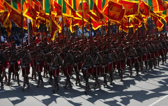 Members from the Sri Lankan military march with national flags during Sri Lanka's 69th Independence day celebrations in Colombo, Sri Lanka February 4, 2017. (Photo by Dinuka Liyanawatte/Reuters)