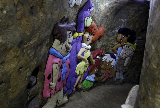 Characters from the cartoon “The Flintstones” are seen painted in a hallway of the house built underground by Manuel Barrantes in San Isidro de Perez Zeledon, Costa Rica, March 14, 2016. (Photo by Juan Carlos Ulate/Reuters)
