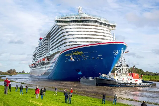 The new cruise ship Carnival Jubilee of the US shipping company Carnival Cruise Line is transferred from the Meyer Werft shipyard to the North Sea via the River Ems in Papenburg, Germany on October 30, 2023. (Photo by Sina Schuldt/dpa via AP Photo)