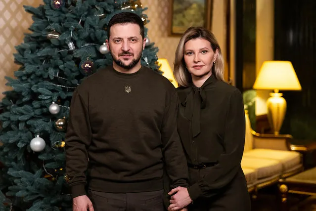 This handout picture taken and released by Ukrainian Presidential Office on December 31, 2022 shows the President Volodymyr Zelensky and his wife Olena during their New Year's address to Ukrainian people. (Photo by AFP Photo/Stringer)