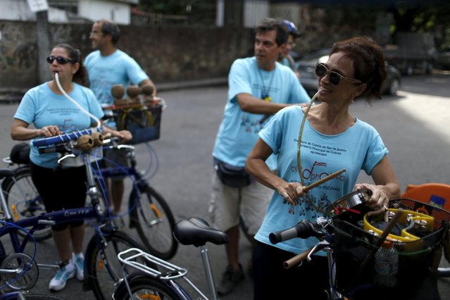Members of the Cyclophonica band play instruments during a ride in Rio de Janeiro May 17, 2015. (Photo by Pilar Olivares/Reuters)