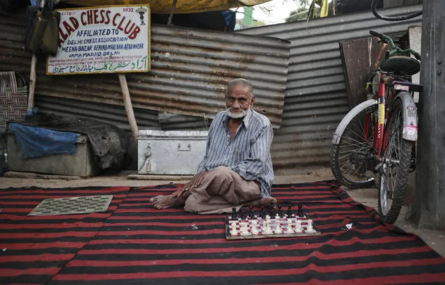 A man looks on as he waits for an opponent to play a game of chess in the old quarters of Delhi, India, April 1, 2016. (Photo by Anindito Mukherjee/Reuters)