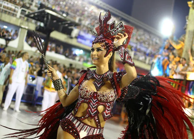 A reveller from the Grande Rio samba school performs during the carnival parade at the Sambadrome in Rio de Janeiro, Brazil, February 27, 2017. (Photo by Pilar Olivares/Reuters)