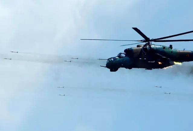 Macedonian army helicopter Mi-24 fires during the “Decisive Strike” exercise hosted by the army of North Macedonia with United States, Albania, Bulgaria and Lithuania's armed forces, at Krivolak training base, North Macedonia on June 17, 2019. (Photo by Ognen Teofilovski/Reuters)