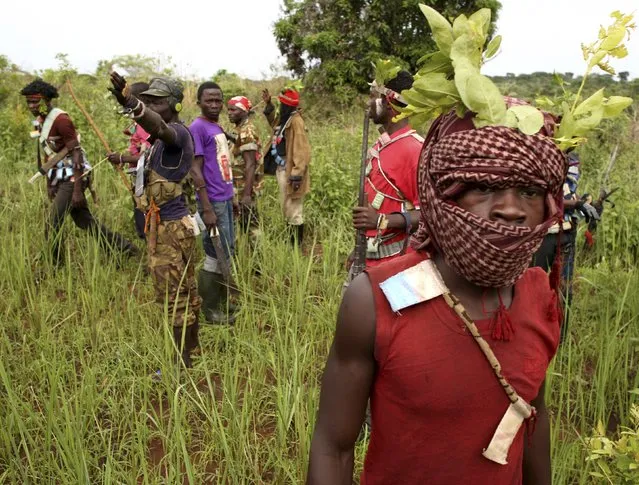 Members of the anti-balaka, a Christian militia, patrol outside the village of Zawa April 8, 2014. (Photo by Goran Tomasevic/Reuters)