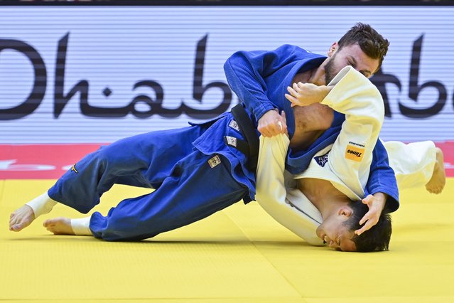 Ryuju Nagayama of Japan (white) competes against independent athlete Ayub Bliev during the men's -60Kg round of 64 bout of the Judo World Championship in Abu Dhabi on May 19, 2024. (Photo by Ryan Lim/AFP Photo)