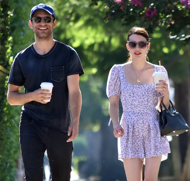 Emma Roberts steps out with boyfriend Garrett Hedlund as they have a few laughs while taking a stroll in Los Angeles on August 15, 2019. (Photo by ENT/Splash News and Pictures)