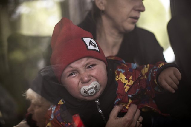 A young woman with her baby evacuated from war-torn city of Vovchansk wait to be transferred to a safer location as Russian military offensive advances on north of Kharkiv region, Kharkiv Oblast, Ukraine, May 20th, 2024. (Photo by Narciso Contreras/Anadolu via Getty Images)