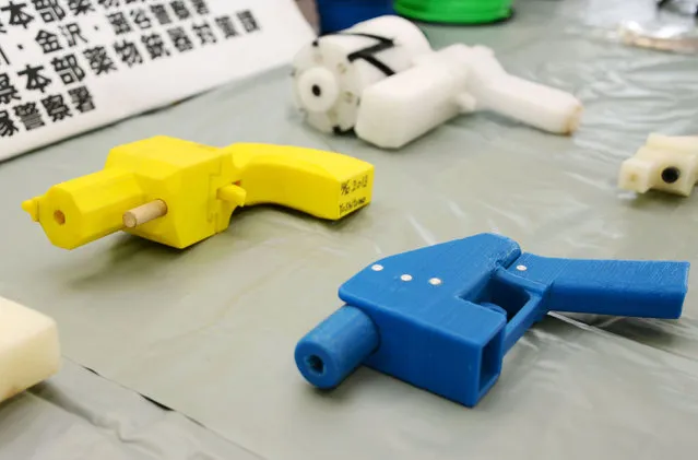 Seized plastic handguns which were created using 3D printing technology are displayed at Kanagawa police station in Yokohama, south of Tokyo, in this photo taken by Kyodo May 8, 2014. (Photo by Reuters/Kyodo)