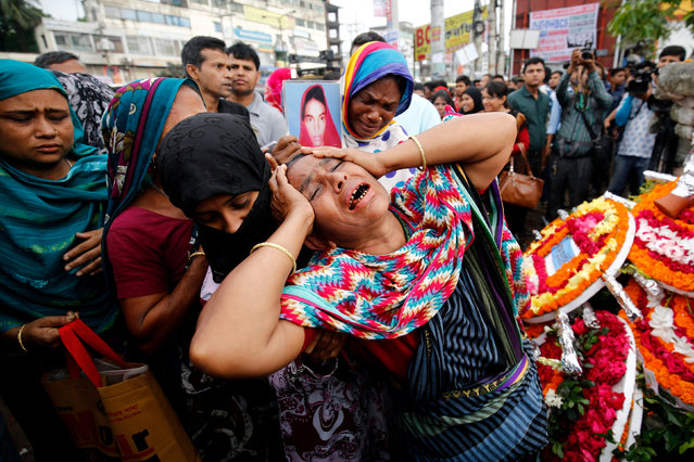 Relatives of victims killed in Rana Plaza building collapse in 2013, mourn at the site during the fourth anniversary of the collapse in Savar, on the outskirt of Dhaka, Bangladesh, April 24, 2017. (Photo by Mohammad Ponir Hossain/Reuters)