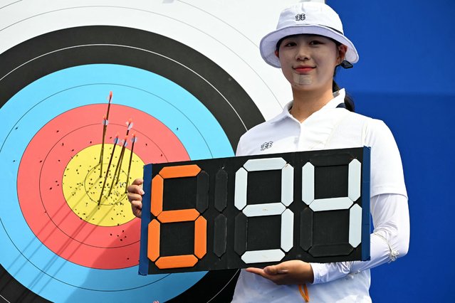 South Korea's Lim Si-hyeon poses after the archery women's individual preliminary round during the Paris 2024 Olympic Games at the Esplanade des Invalides in Paris on July 25, 2024. (Photo by Punit Paranjpe/AFP Photo)