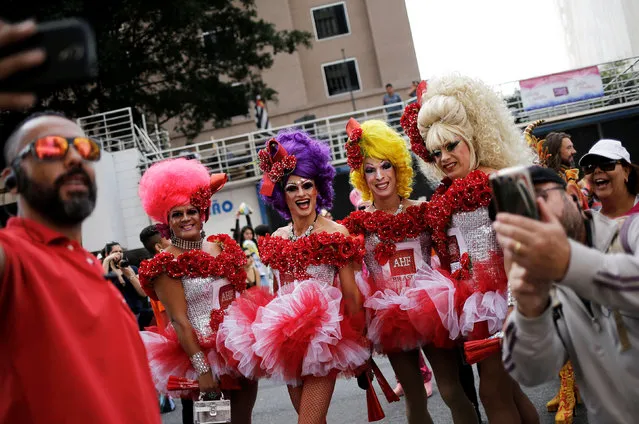 Revellers take part in the annual Gay Pride parade along Paulista Avenue in Sao Paulo, Brazil, May 29, 2016. (Photo by Nacho Doce/Reuters)