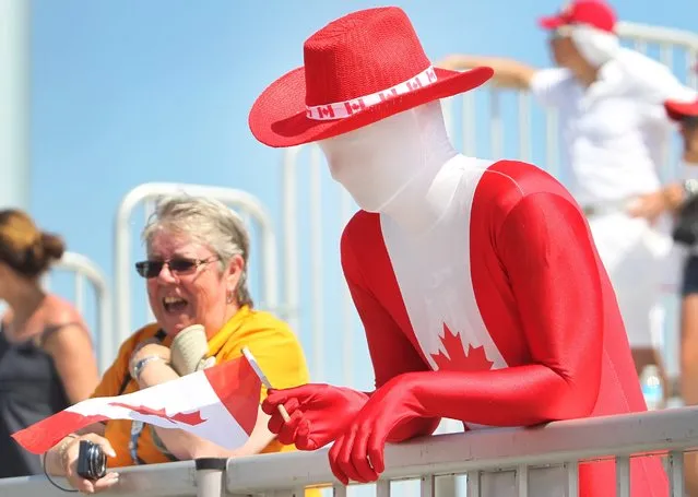 A Canadian fan watches the gold medal women's baseball game between Canada and USA at the Pan Am Games in Ajax, Ontario, Sunday, July 26, 2015. The United States won the gold medal in the event. (Photo by Fred Thornhill/The Canadian Press via AP Photo)