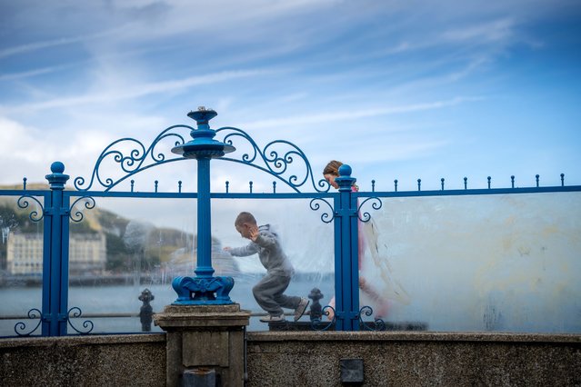 Children play on the bandstand as warm temperatures bring day trippers and holidaymakers to the seaside on August 12, 2024 in Llandudno, United Kingdom. Temperatures remain elevated following a bright and clear weekend in the South East, while northern regions of Northern Ireland and Scotland brace for thunderstorms. (Photo by Christopher Furlong/Getty Images)